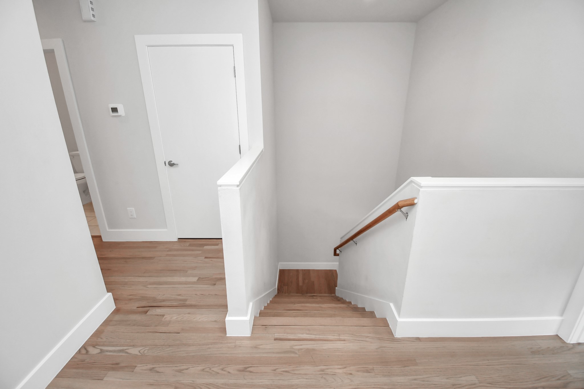 4709 Oats Street Houston, TX 77020 - Photo 13 of 34 a view of entryway and hall with wooden floor