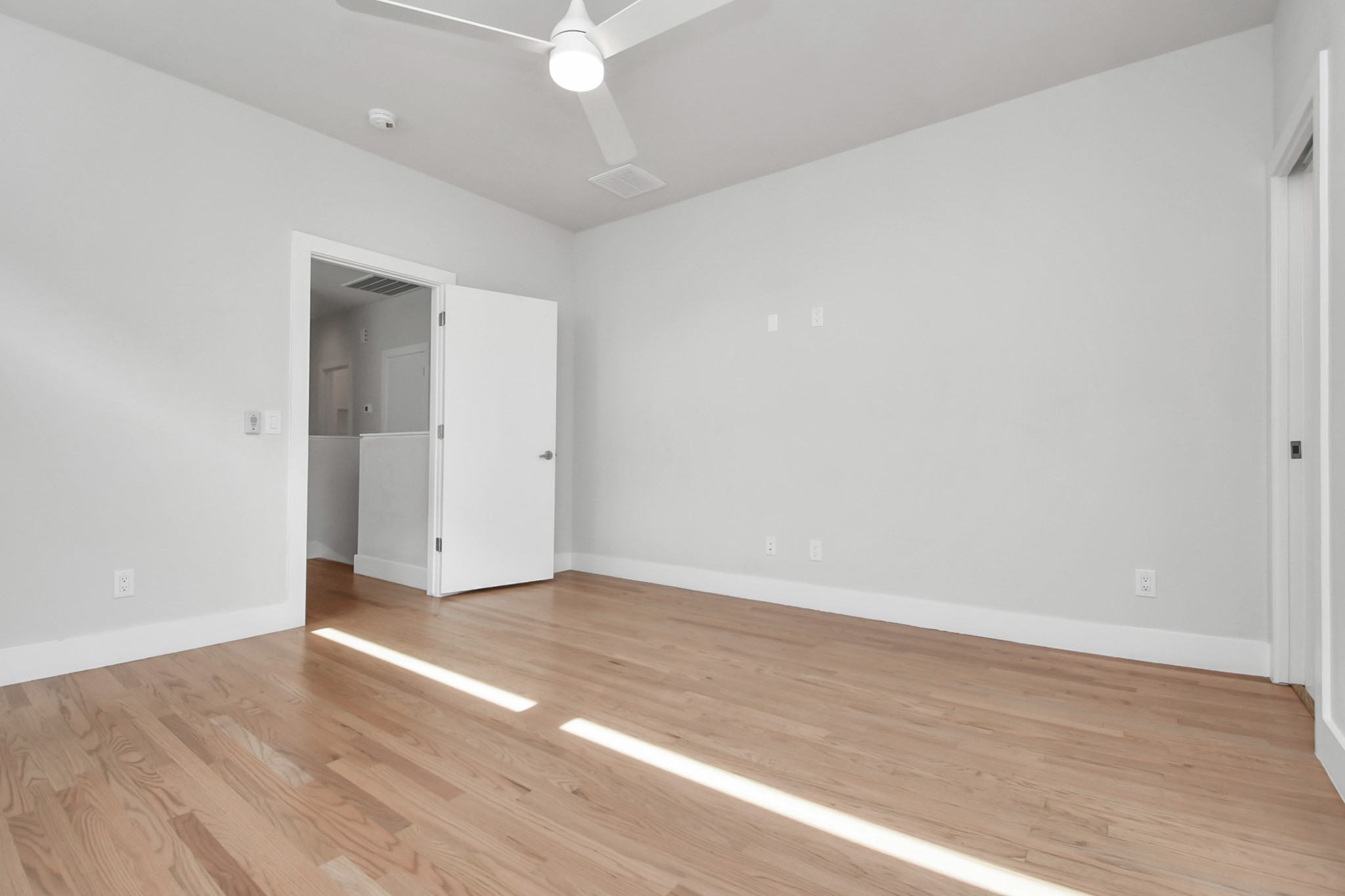 4709 Oats Street Houston, TX 77020 - Photo 21 of 34 a view of an empty room with wooden floor
