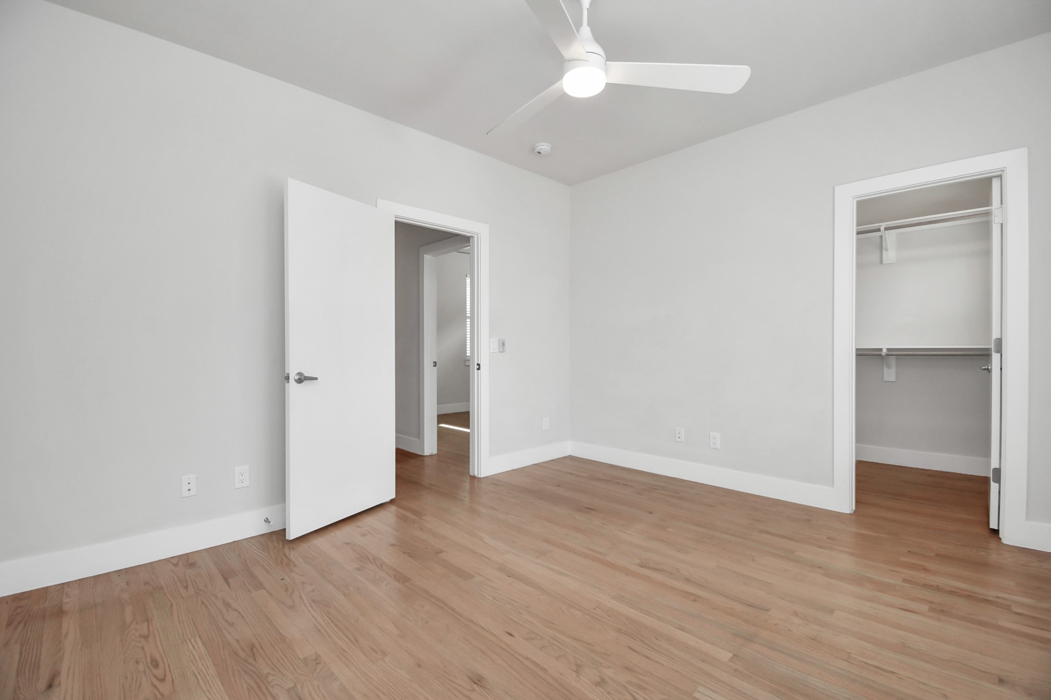 4709 Oats Street Houston, TX 77020 - Photo 26 of 34 an empty room with wooden floor and ceiling fan