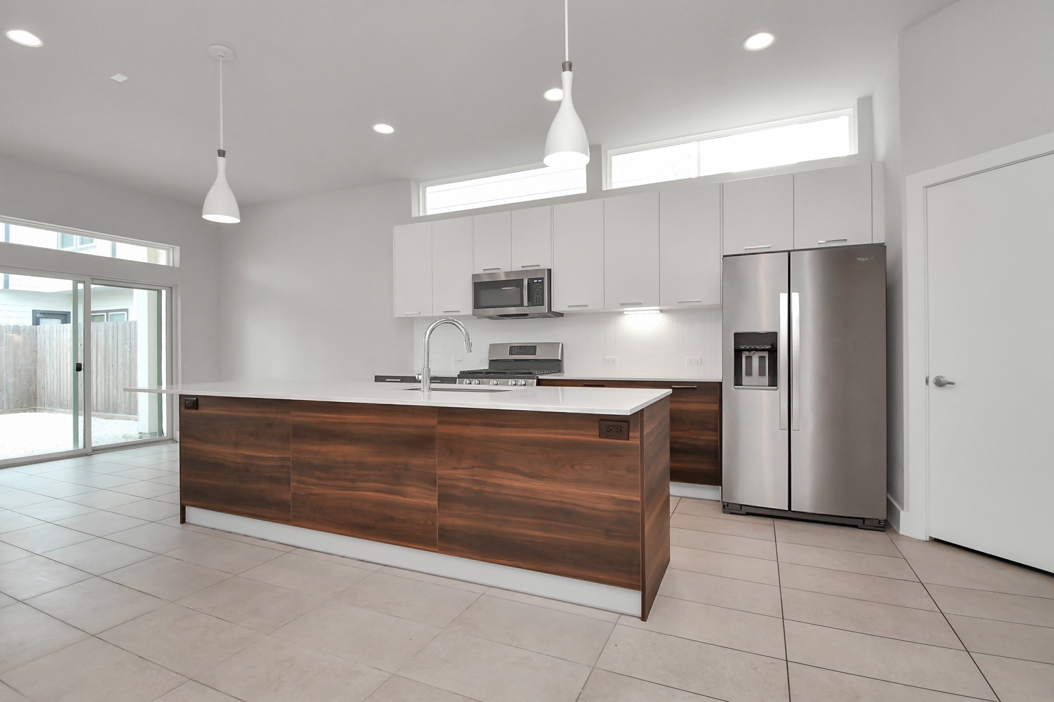 4709 Oats Street Houston, TX 77020 - Photo 4 of 34 a large kitchen with a refrigerator and a sink
