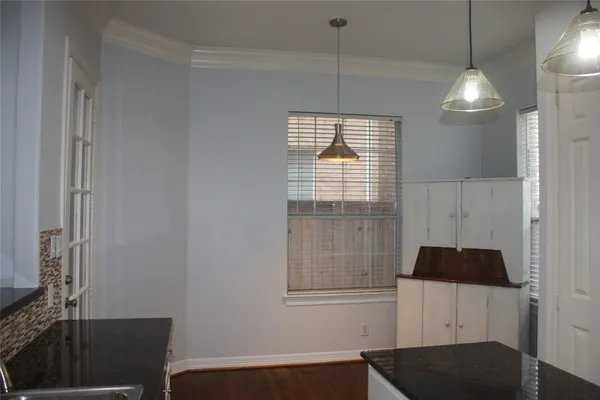 a picture of a window and a chandelier