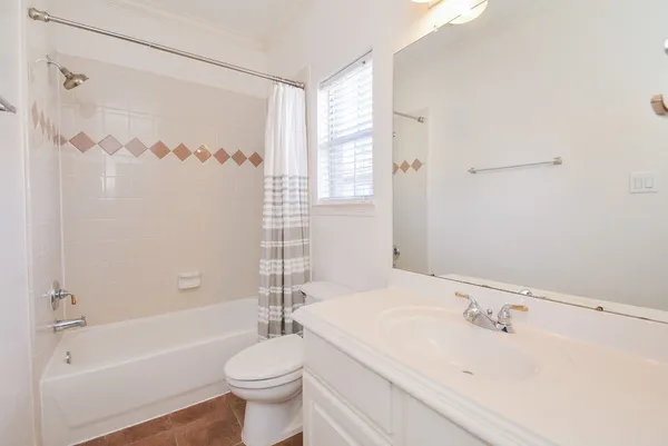 a bathroom with a sink a toilet and a bathtub