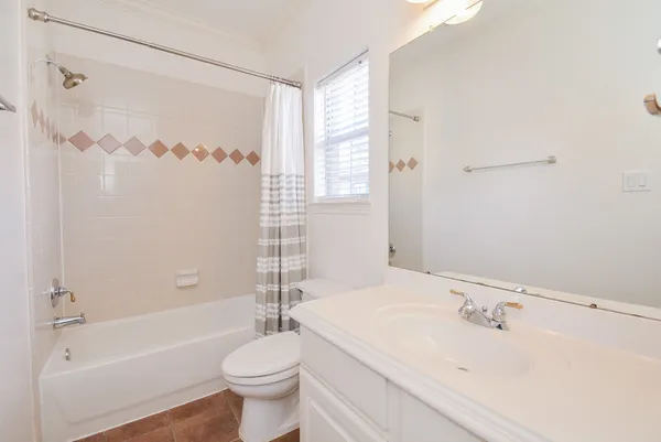 a bathroom with a sink a toilet and a bathtub