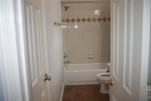 a bathroom with a shower and a toilet