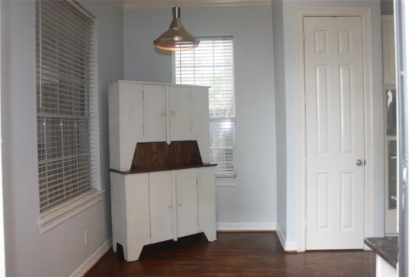 a kitchen with a refrigerator and window