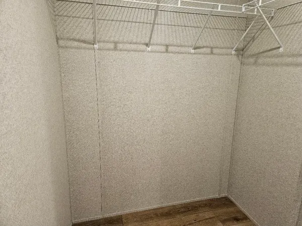 a view of a room that has a window in it