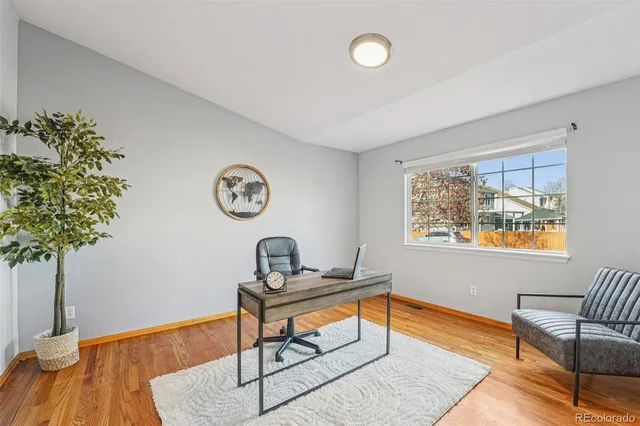a living room with furniture a table and a window