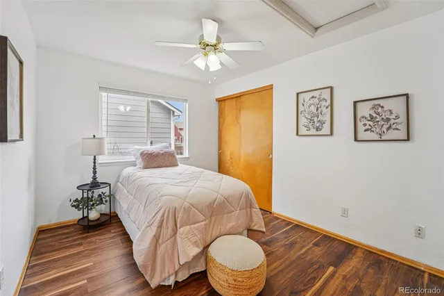 a bathroom with a sink vanity mirror and toilet