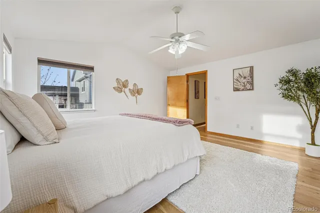 a bathroom with a granite countertop sink a toilet and a mirror