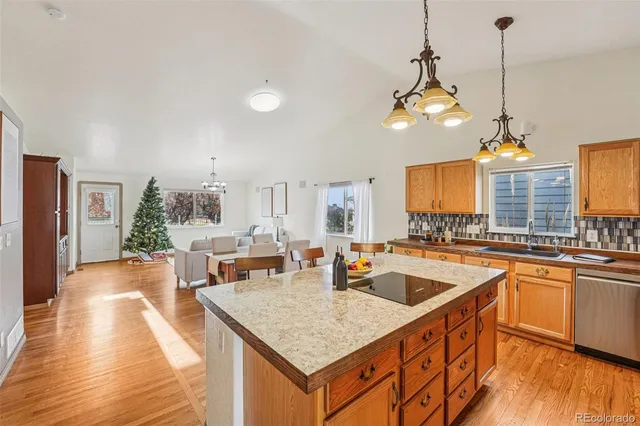 a kitchen with counter top space appliances and cabinets