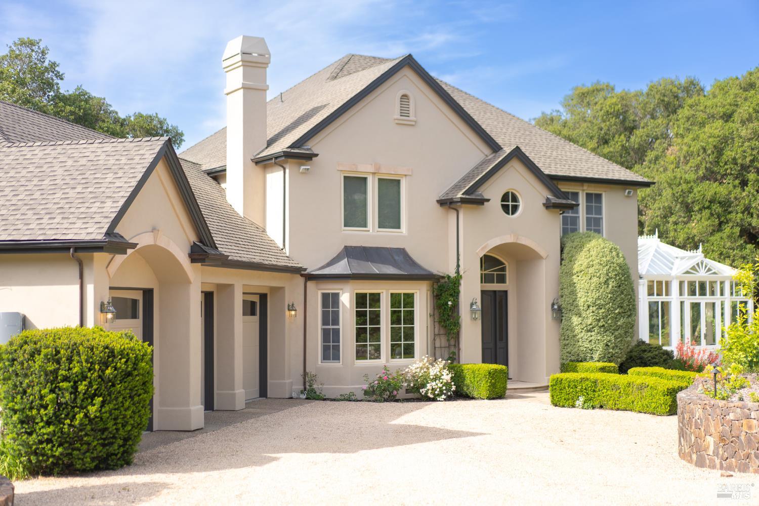 a front view of a house with garden