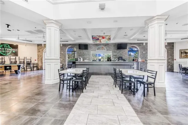 a view of a chairs and table in a patio