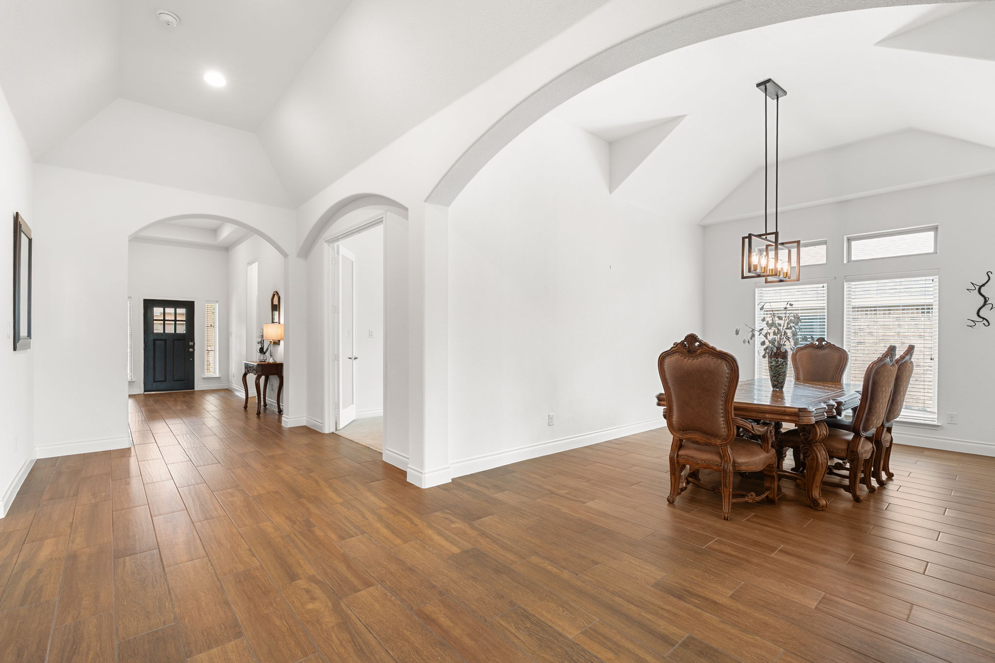 1908 Woolsey Way Leander, TX 78641 - Photo 8 of 36 This inviting space features vaulted ceilings, and an expansive dining area.