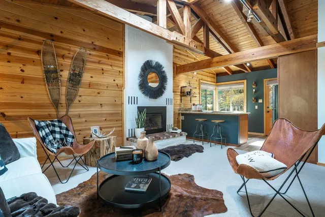 a living room with furniture and a table