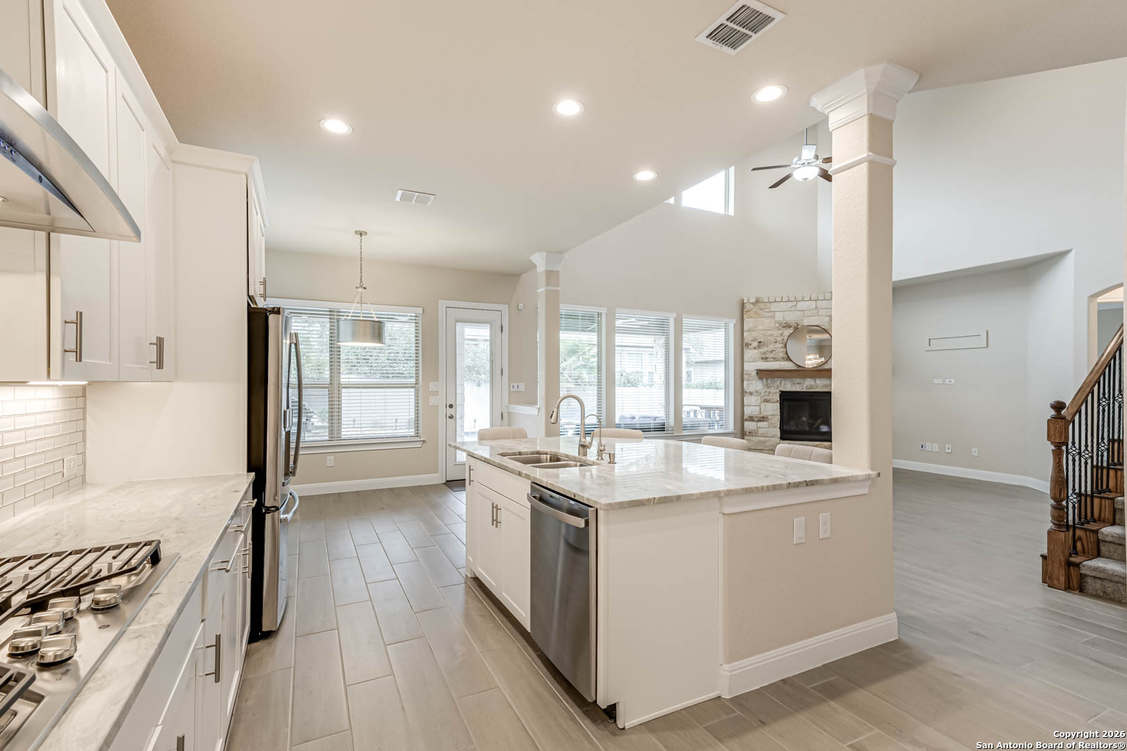 17419 Hillsedge Road San Antonio, TX 78257 - Photo 11 of 57 a kitchen with a stove a sink and a refrigerator