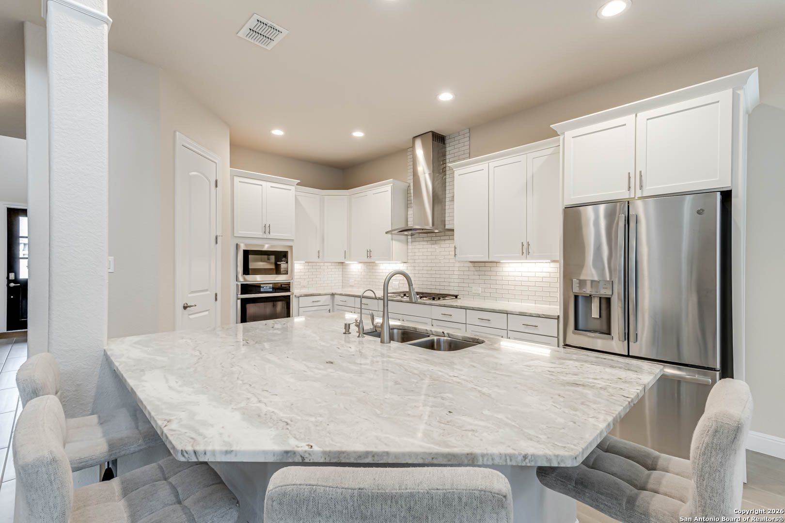 17419 Hillsedge Road San Antonio, TX 78257 - Photo 13 of 57 a kitchen with stainless steel appliances granite countertop a sink refrigerator and cabinets