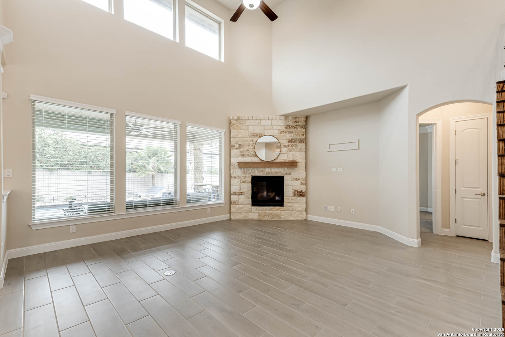 17419 Hillsedge Road San Antonio, TX 78257 - Photo 19 of 57 a view of an empty room with a window and fireplace