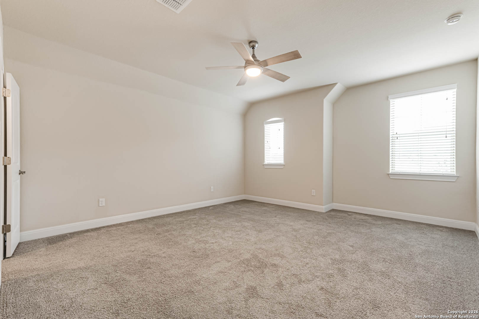 17419 Hillsedge Road San Antonio, TX 78257 - Photo 34 of 57 an empty room with windows and fan window
