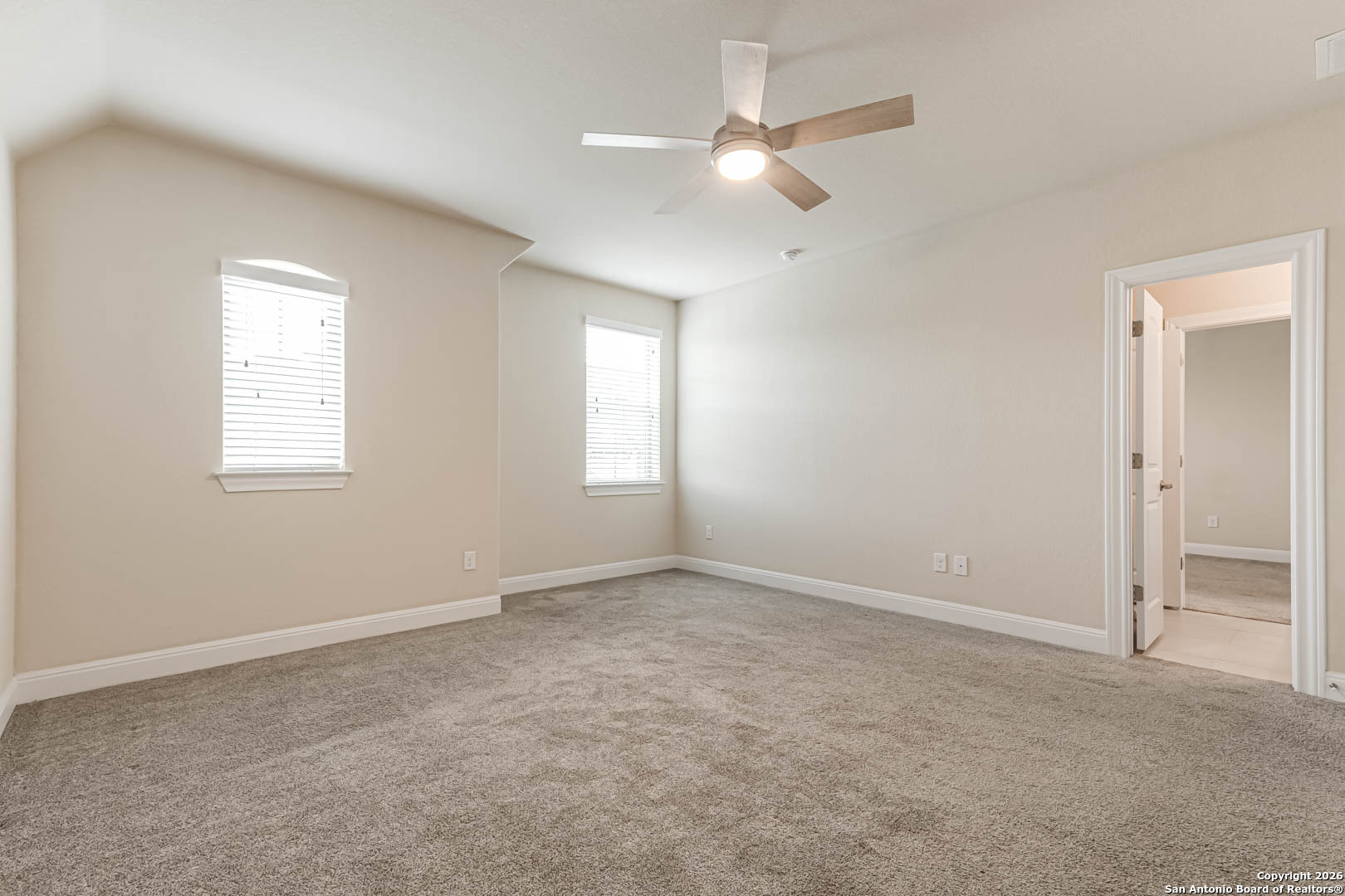 17419 Hillsedge Road San Antonio, TX 78257 - Photo 35 of 57 an empty room with windows and fan