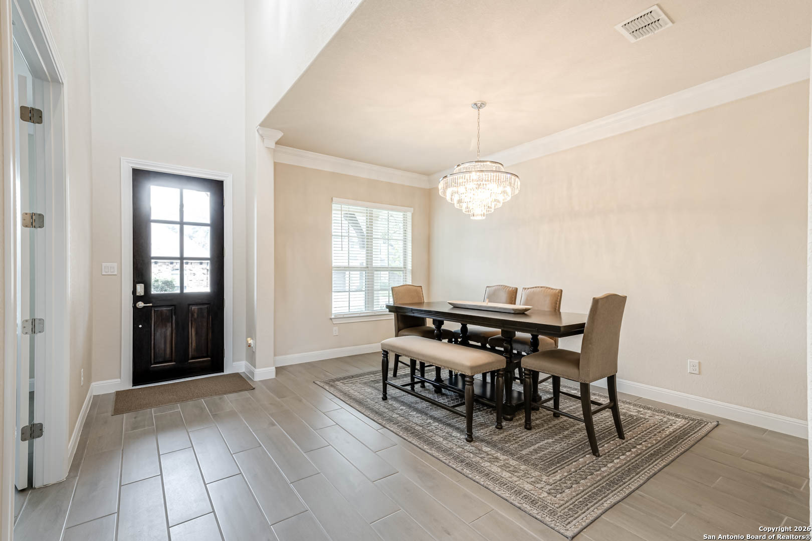 17419 Hillsedge Road San Antonio, TX 78257 - Photo 4 of 57 a living room with a table chairs and a dining table with wooden floor
