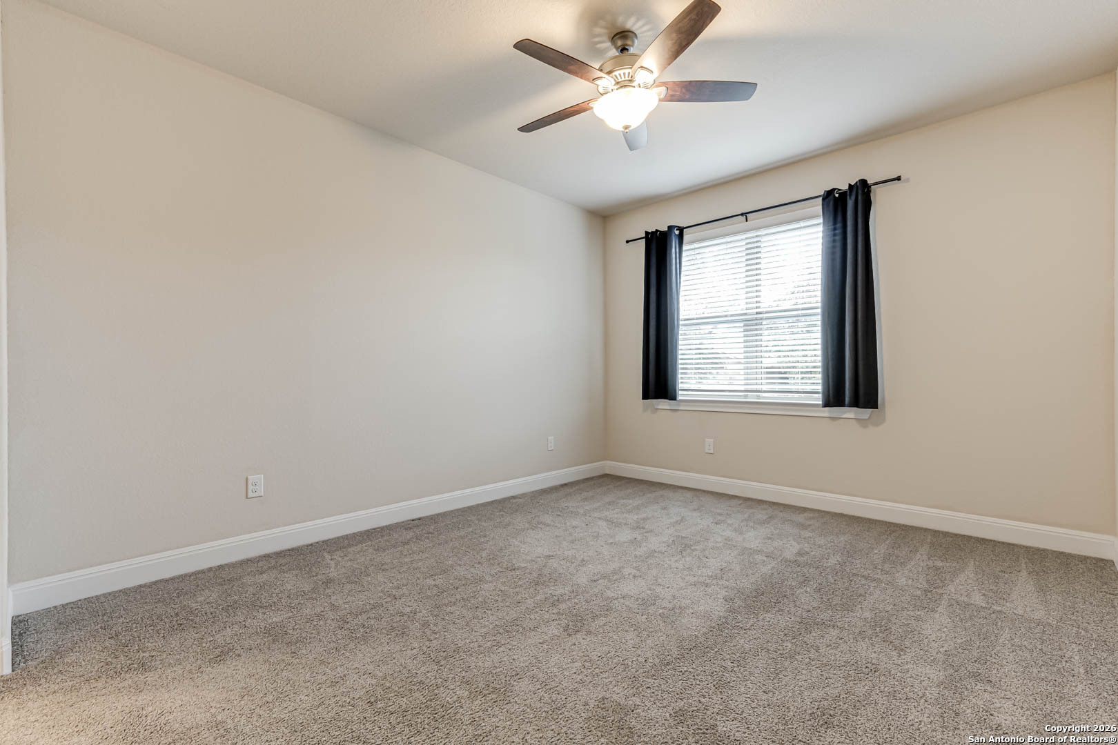 17419 Hillsedge Road San Antonio, TX 78257 - Photo 41 of 57 an empty room with a window and a fan