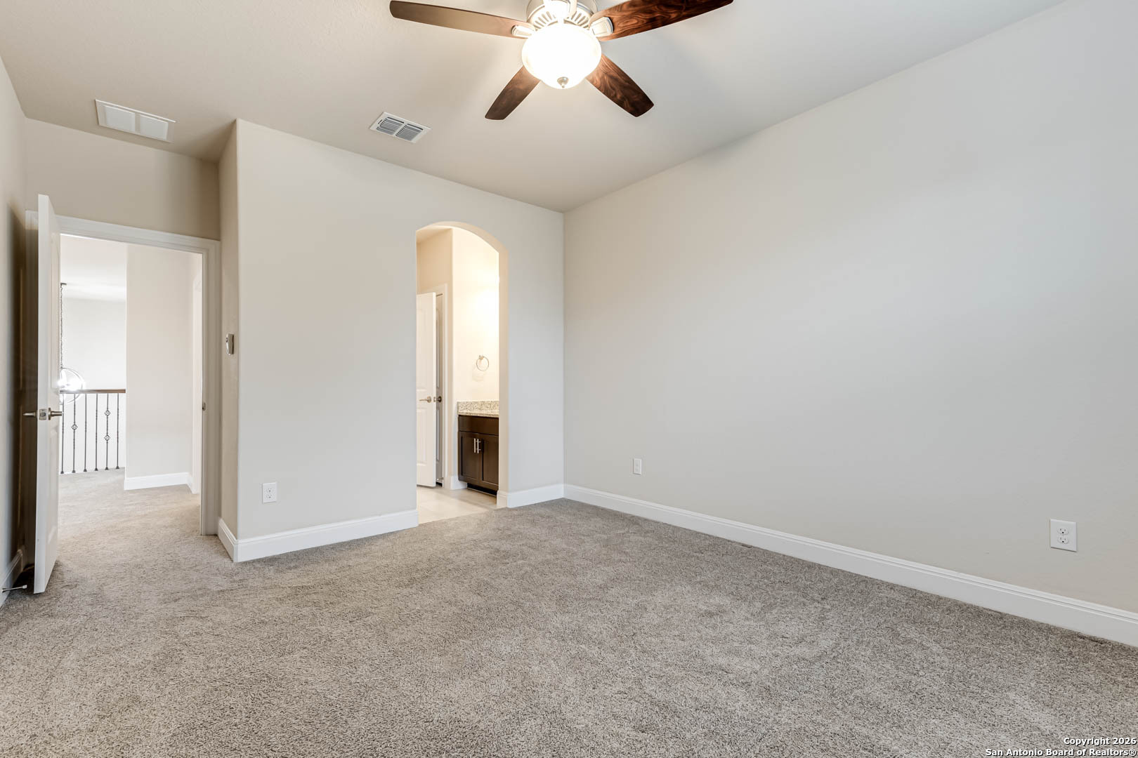 17419 Hillsedge Road San Antonio, TX 78257 - Photo 42 of 57 an empty room with chandelier fan and windows