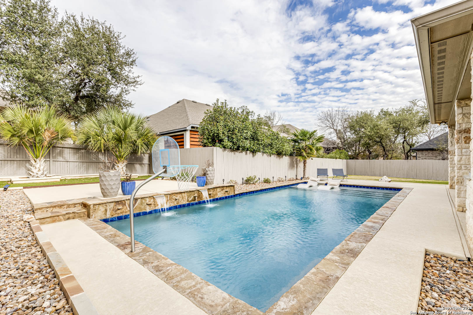 17419 Hillsedge Road San Antonio, TX 78257 - Photo 51 of 57 a view of a swimming pool with a lounge chairs