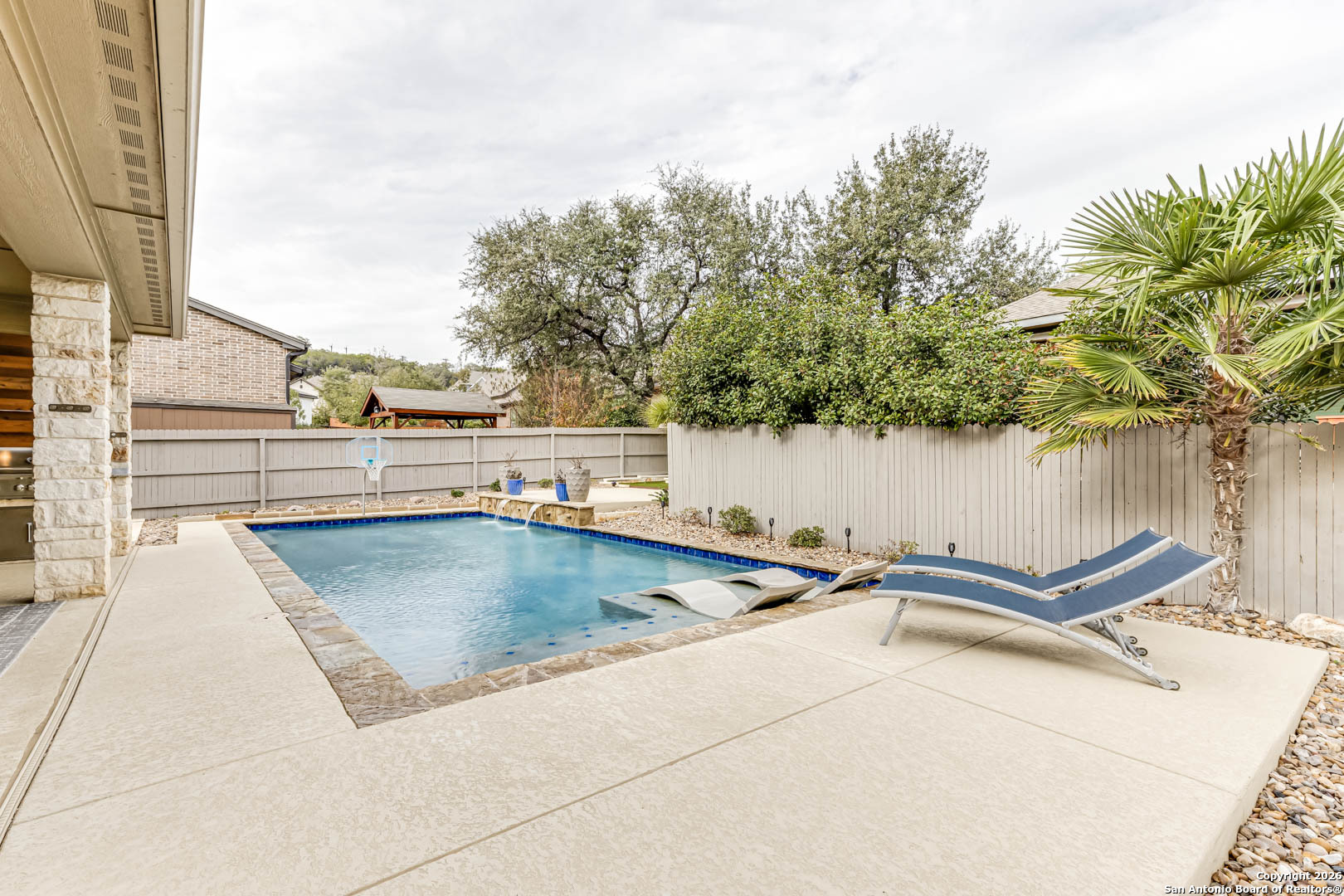 17419 Hillsedge Road San Antonio, TX 78257 - Photo 52 of 57 a view of a swimming pool with a chair