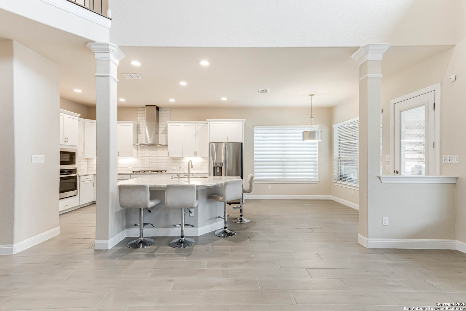 17419 Hillsedge Road San Antonio, TX 78257 - Photo 10 of 57 a view of kitchen with kitchen island dining table and chairs