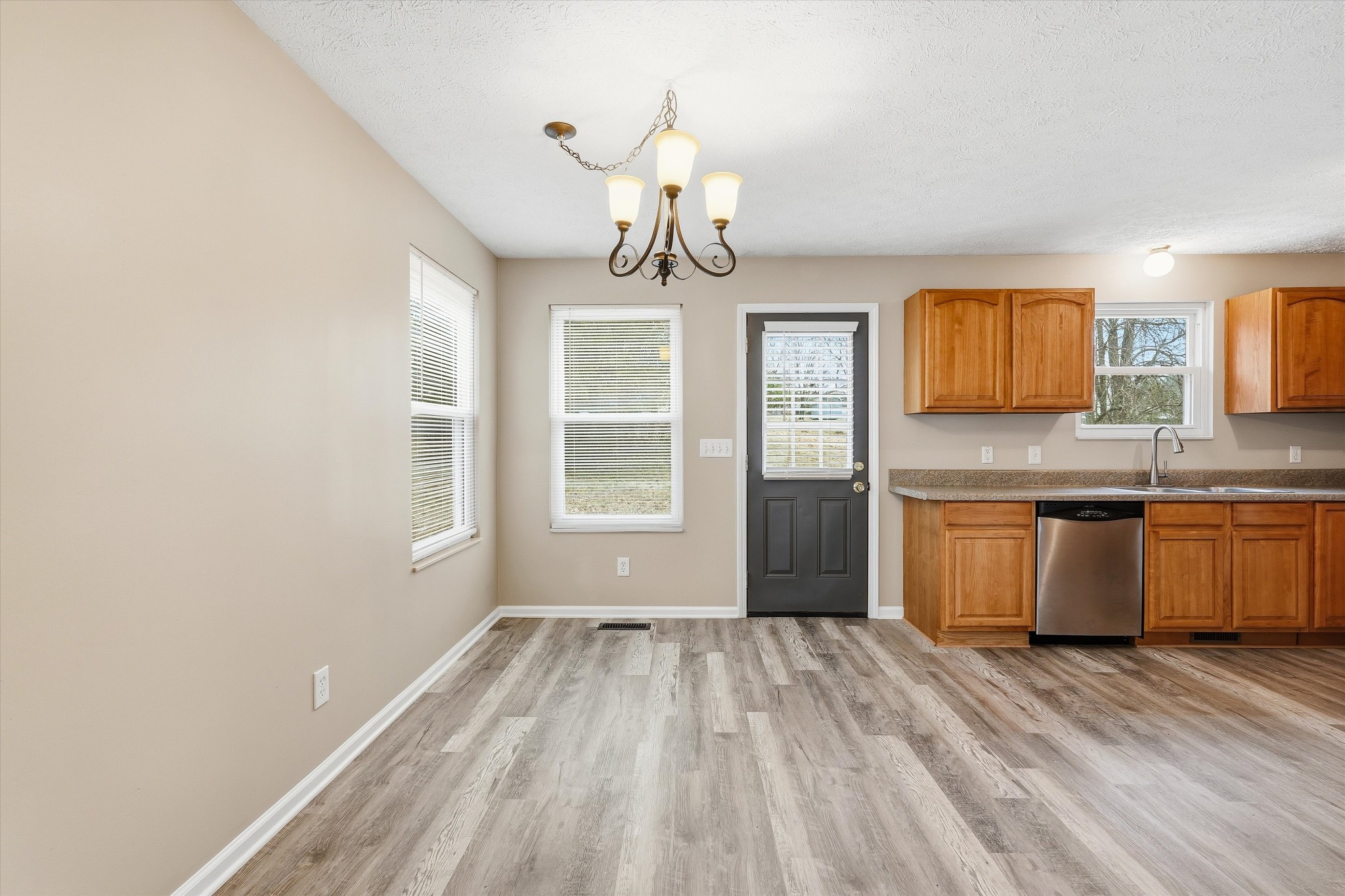 7641 Saundersville Road Mount Juliet, TN 37122 - Photo 11 of 29 a view of kitchen with granite countertop window and wooden floor