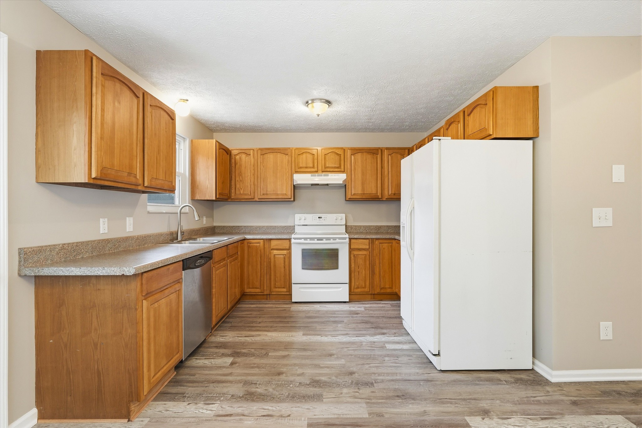 7641 Saundersville Road Mount Juliet, TN 37122 - Photo 12 of 29 a kitchen with stainless steel appliances granite countertop a refrigerator sink and cabinets
