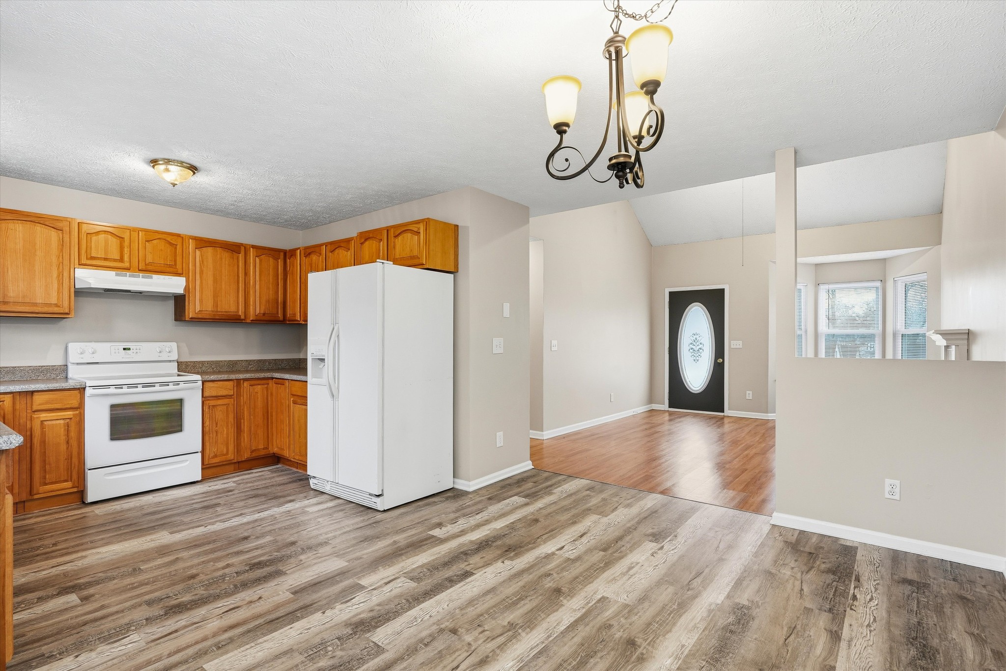 7641 Saundersville Road Mount Juliet, TN 37122 - Photo 15 of 29 a kitchen with stainless steel appliances granite countertop a stove and a refrigerator
