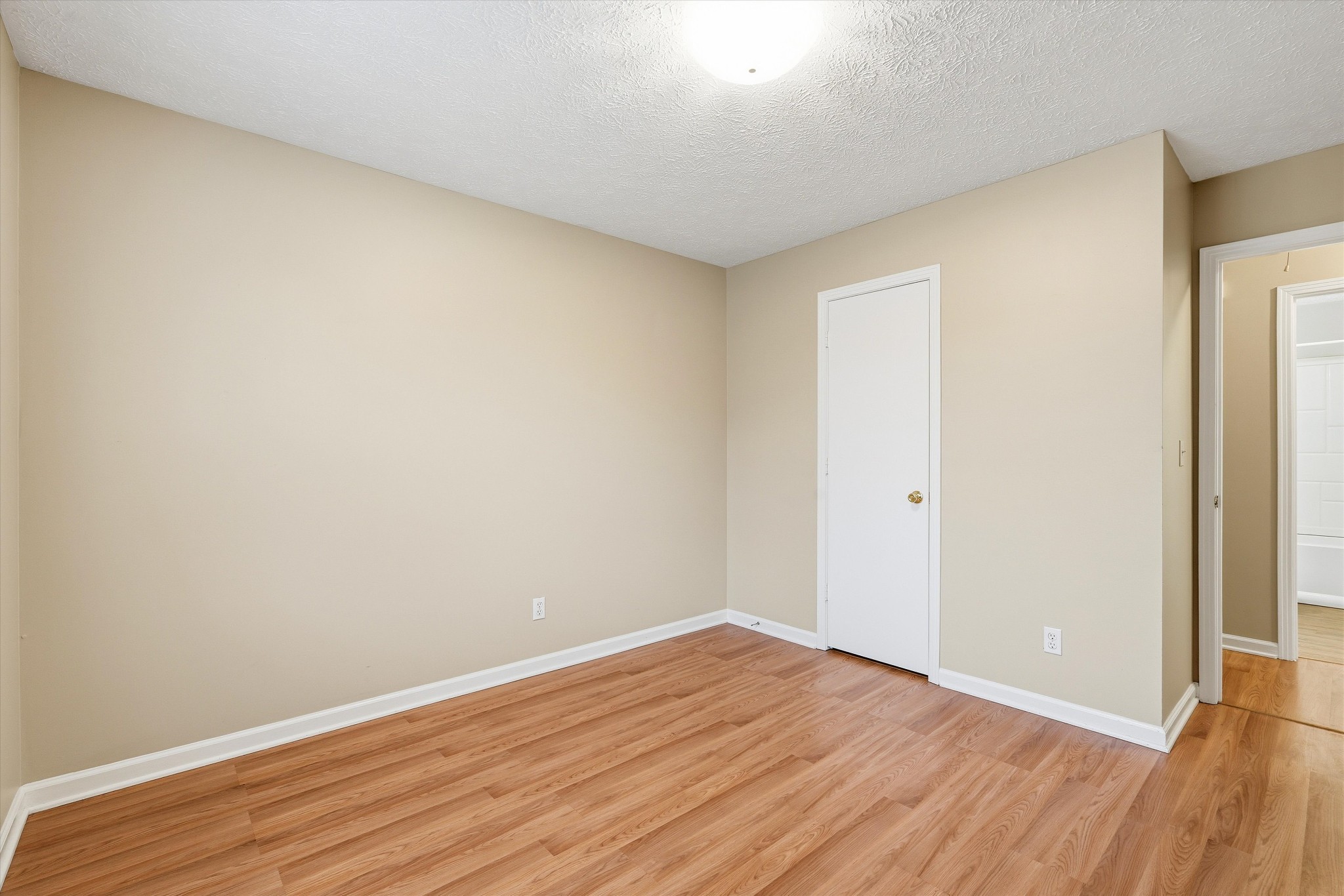 7641 Saundersville Road Mount Juliet, TN 37122 - Photo 19 of 29 a view of an empty room with wooden floor