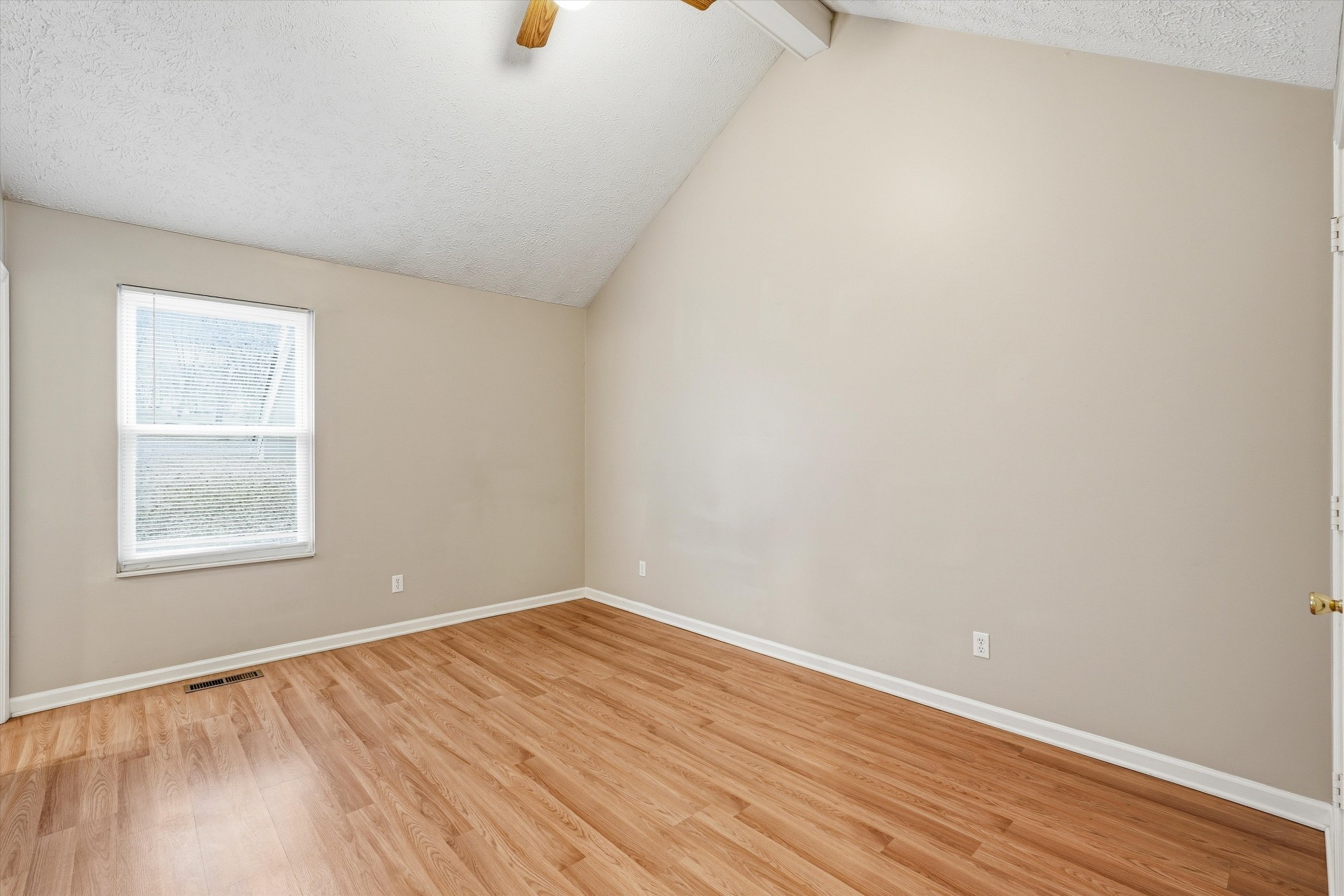 7641 Saundersville Road Mount Juliet, TN 37122 - Photo 22 of 29 an empty room with wooden floor and windows