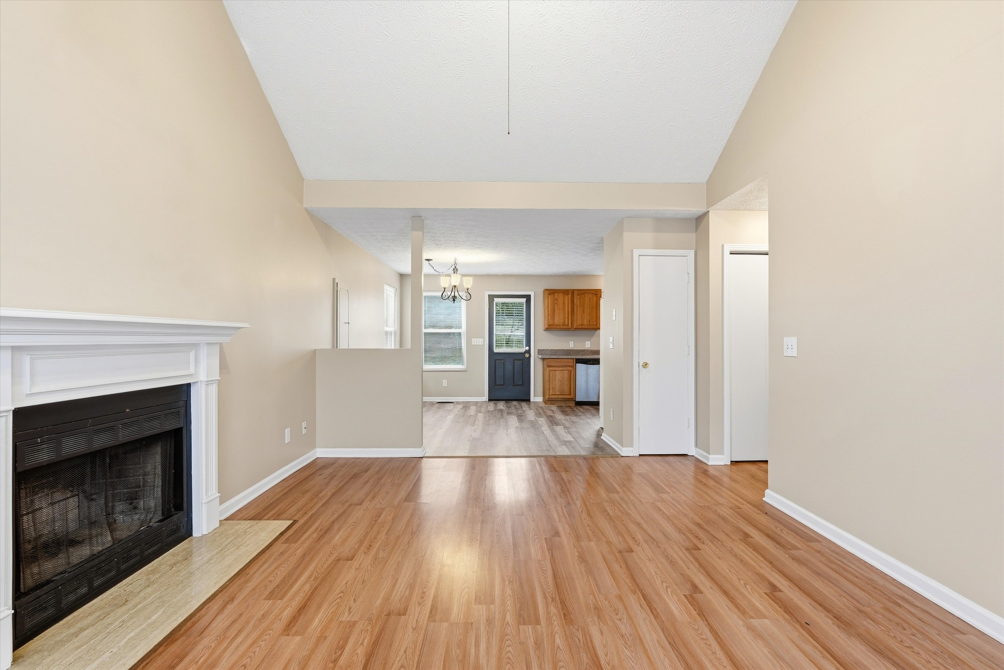 7641 Saundersville Road Mount Juliet, TN 37122 - Photo 8 of 29 a view of empty room with wooden floor and fireplace