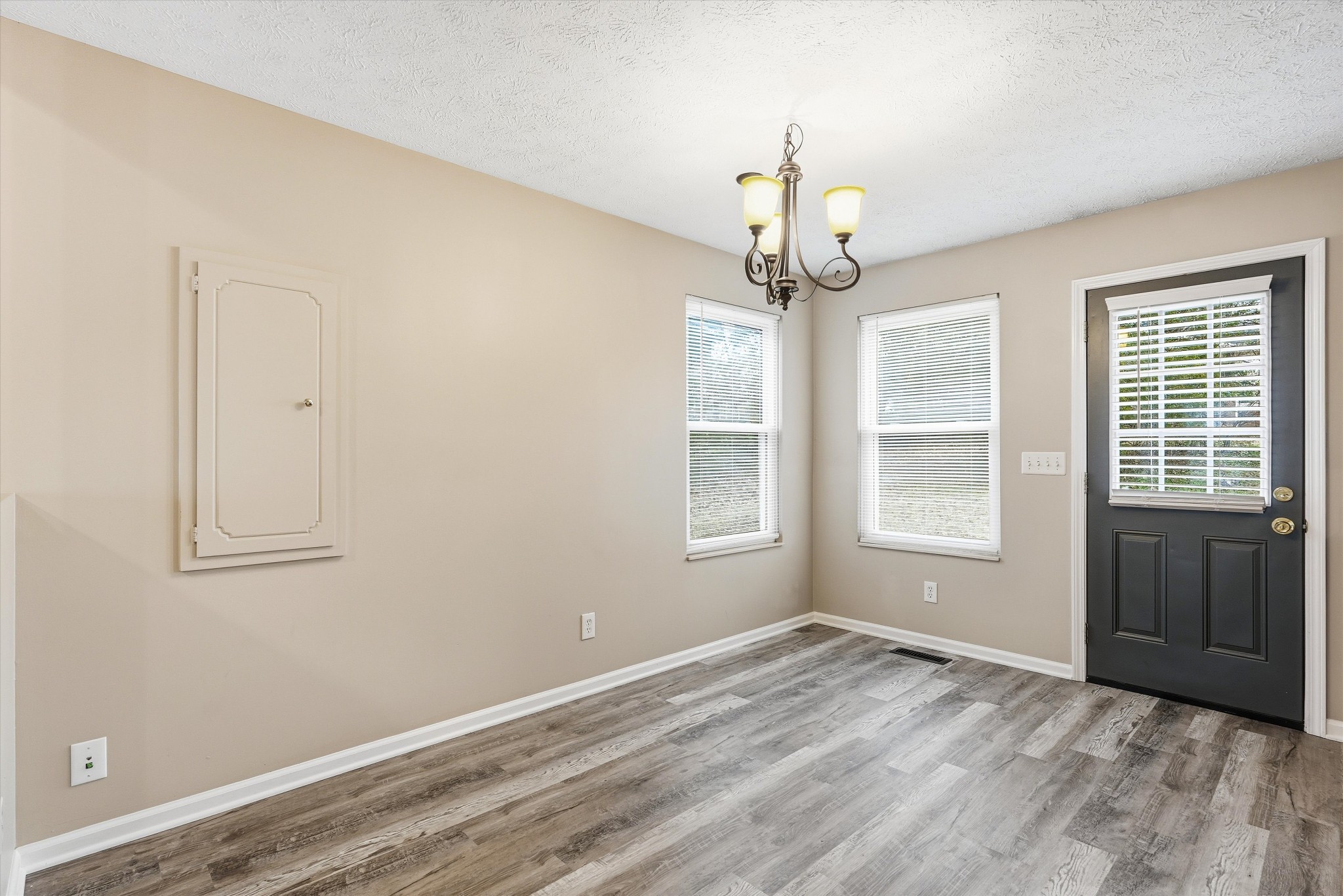 7641 Saundersville Road Mount Juliet, TN 37122 - Photo 9 of 29 wooden floor in an empty room with a window