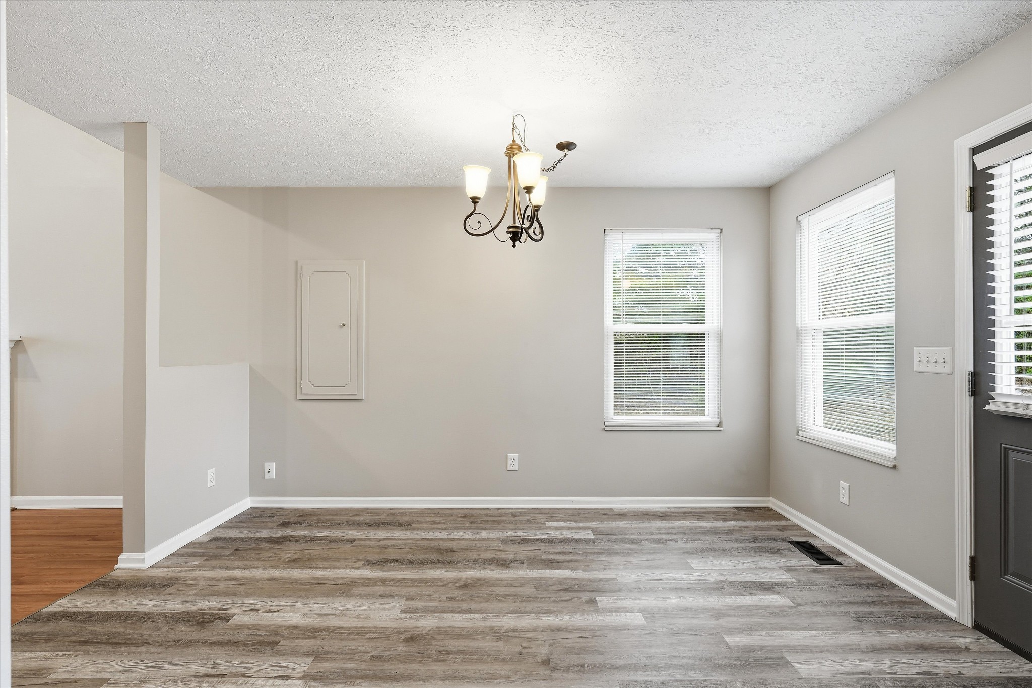 7641 Saundersville Road Mount Juliet, TN 37122 - Photo 10 of 29 a view of empty room with wooden floor and fan