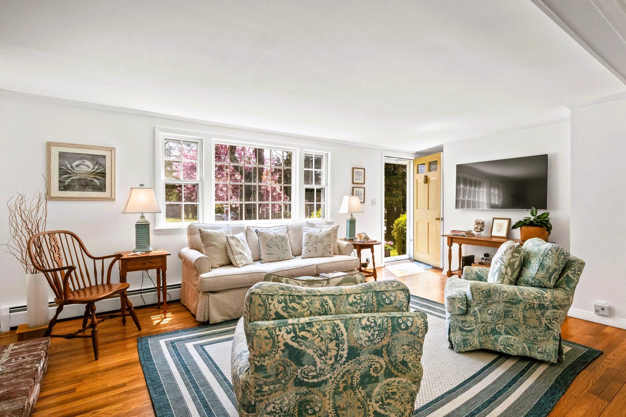 9 Doane Road Orleans, MA 02653 - Photo 13 of 31 a living room with furniture and a flat screen tv