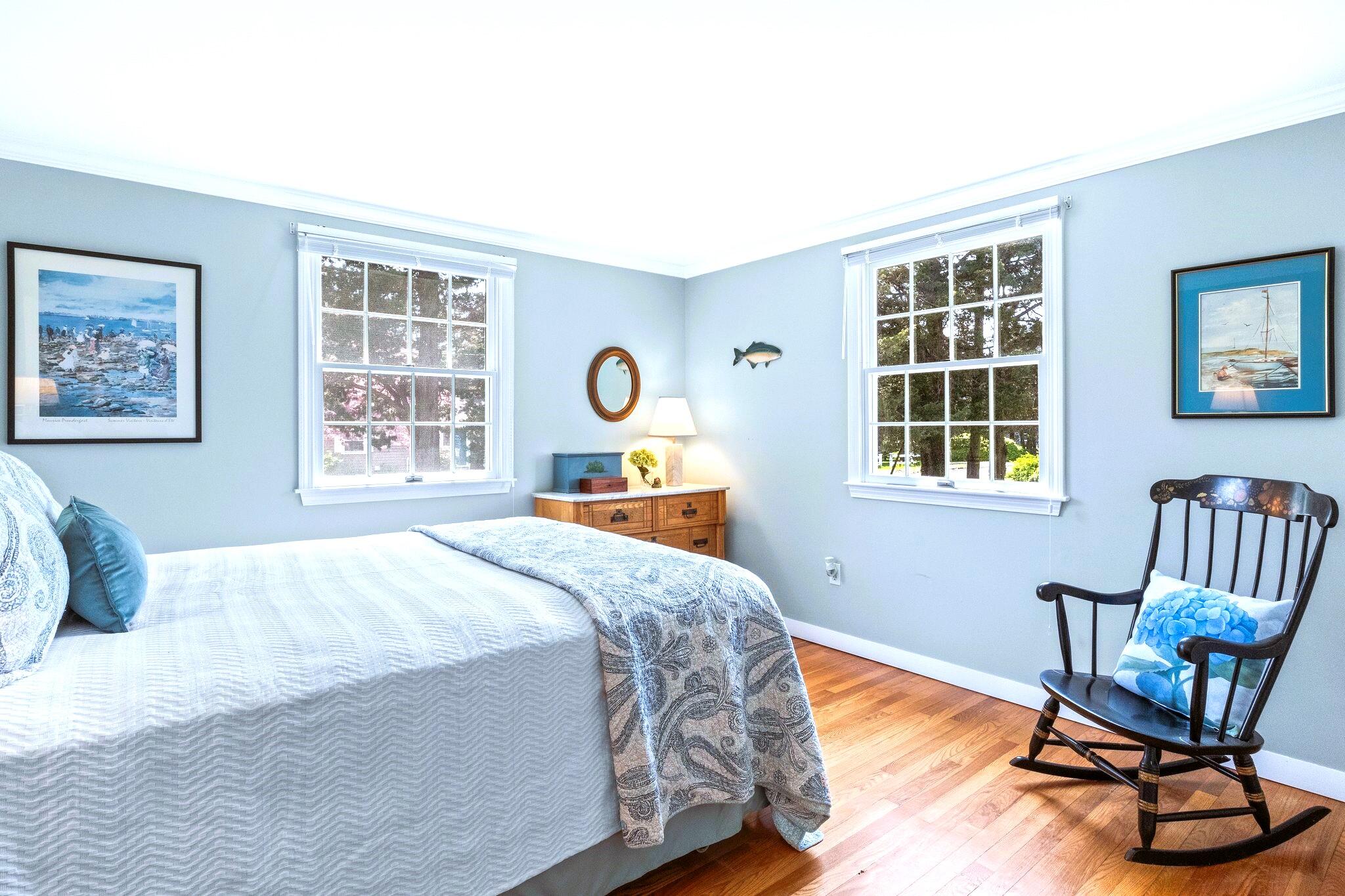 9 Doane Road Orleans, MA 02653 - Photo 20 of 31 a bedroom with a bed chair and window