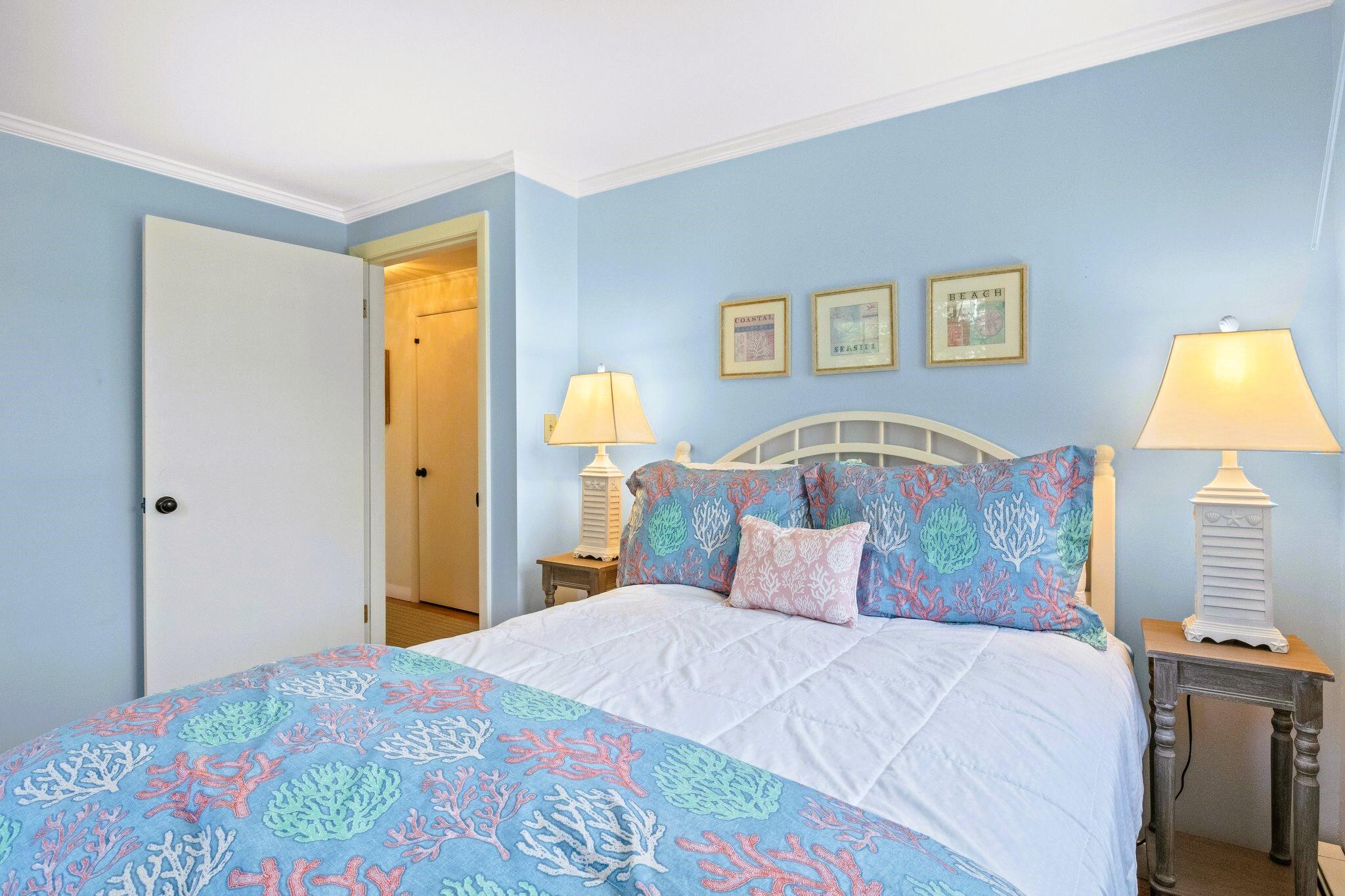 9 Doane Road Orleans, MA 02653 - Photo 21 of 31 a bedroom with a bed and a lamp