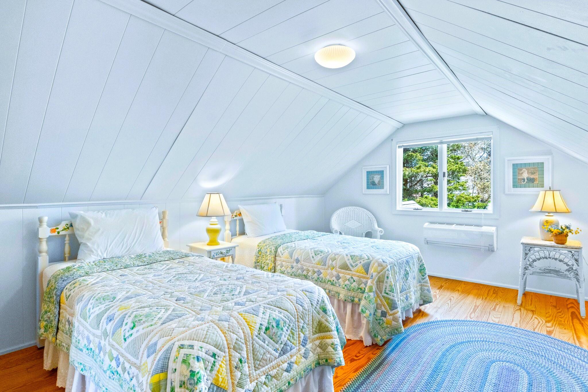 9 Doane Road Orleans, MA 02653 - Photo 25 of 31 a bedroom with two beds and a large window
