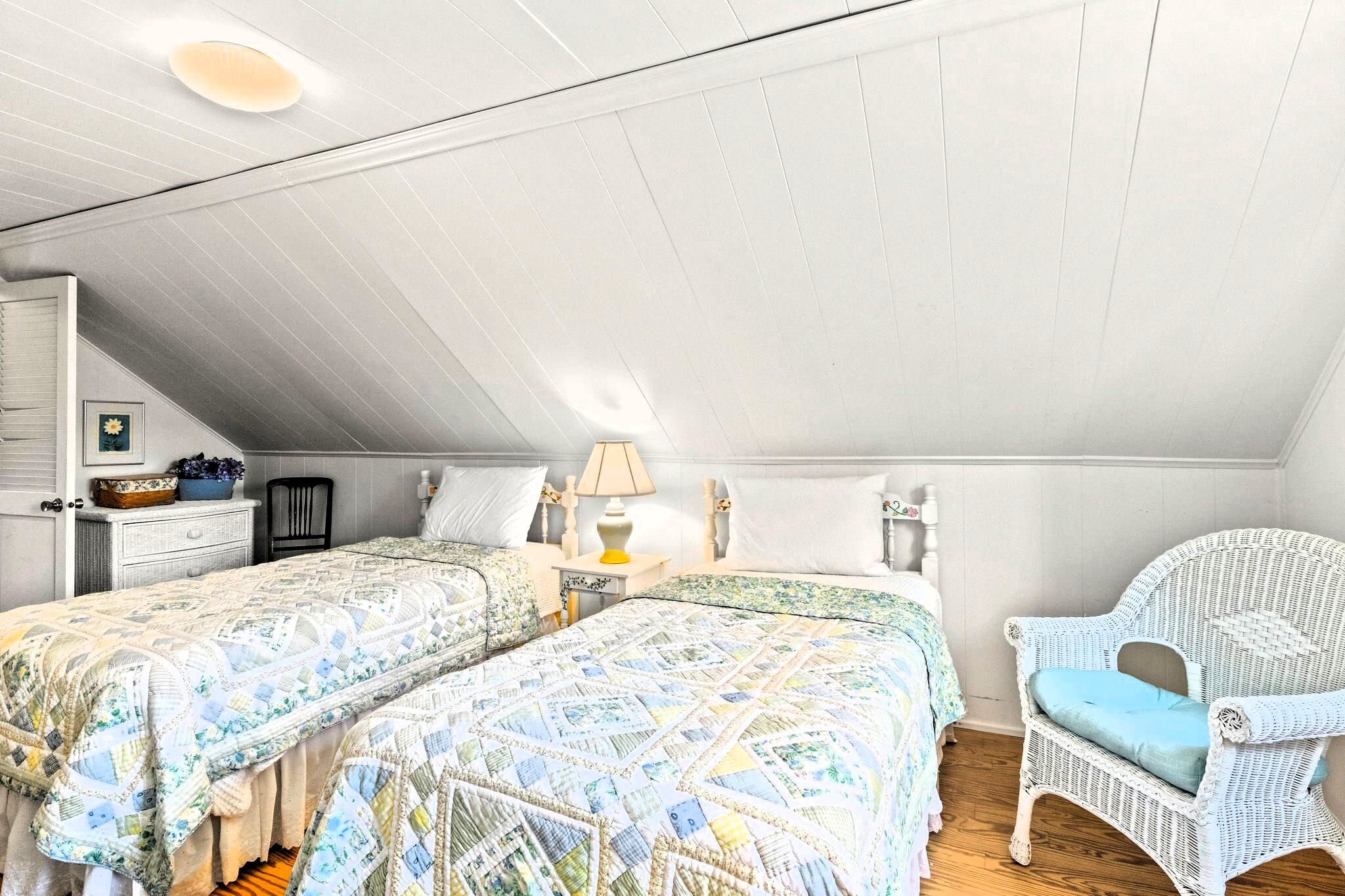 9 Doane Road Orleans, MA 02653 - Photo 26 of 31 a bedroom with double bed and a couch