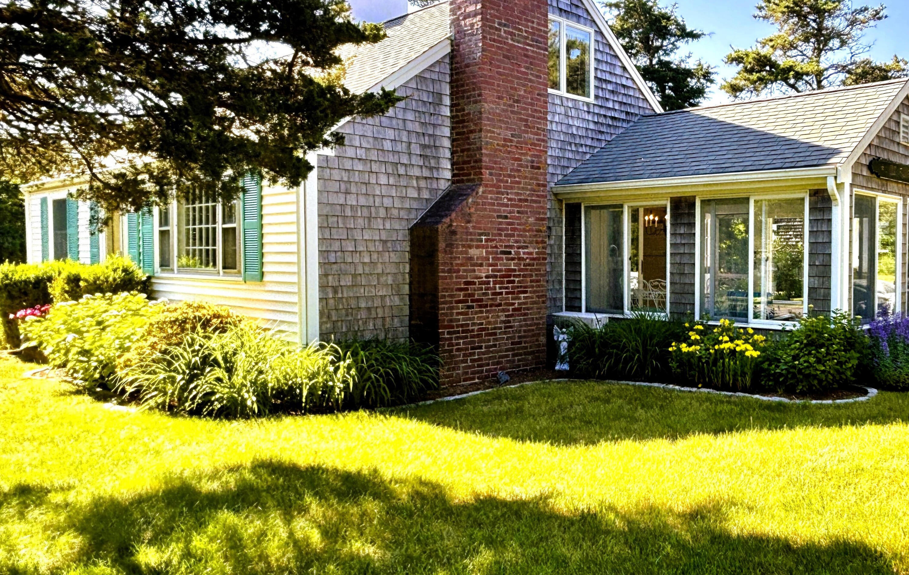 9 Doane Road Orleans, MA 02653 - Photo 27 of 31 a view of a house with a garden