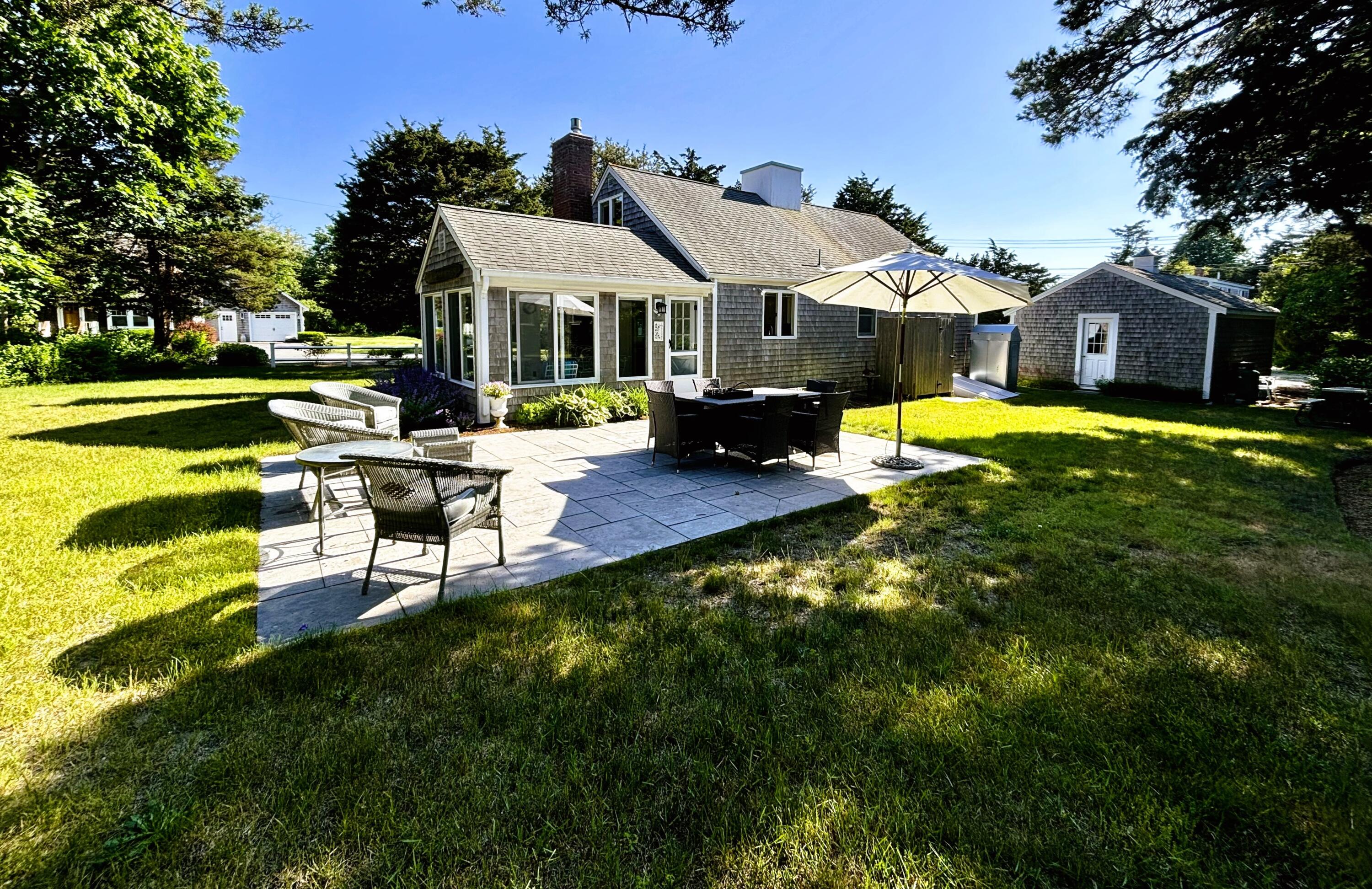 9 Doane Road Orleans, MA 02653 - Photo 29 of 31 a view of a house with swimming pool and sitting area