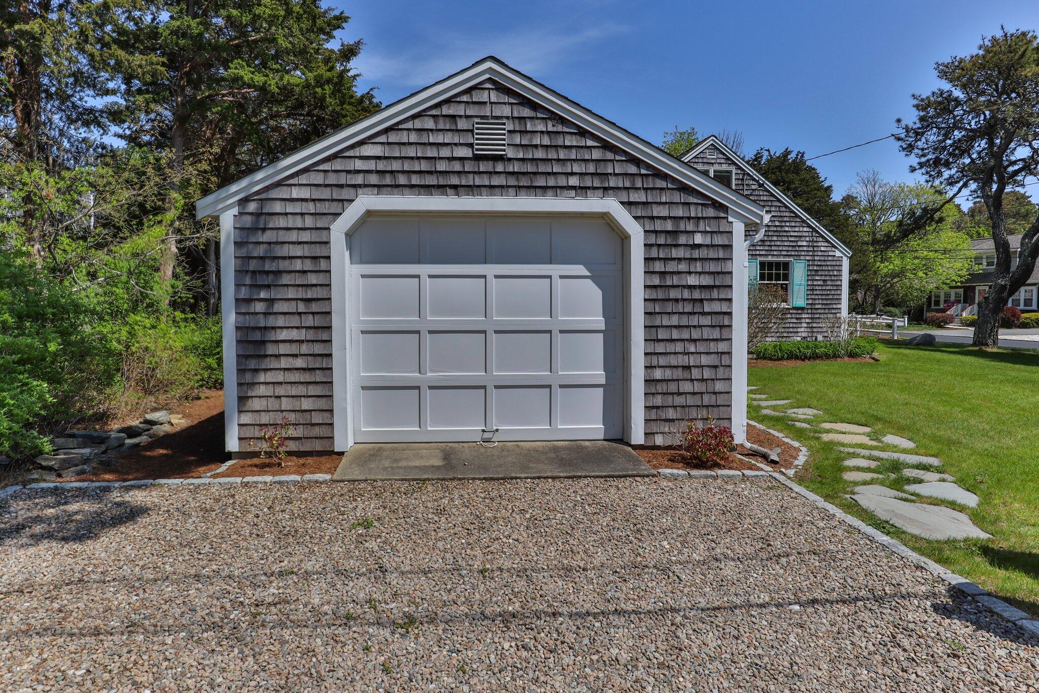 9 Doane Road Orleans, MA 02653 - Photo 30 of 31 a front view of a house with a yard