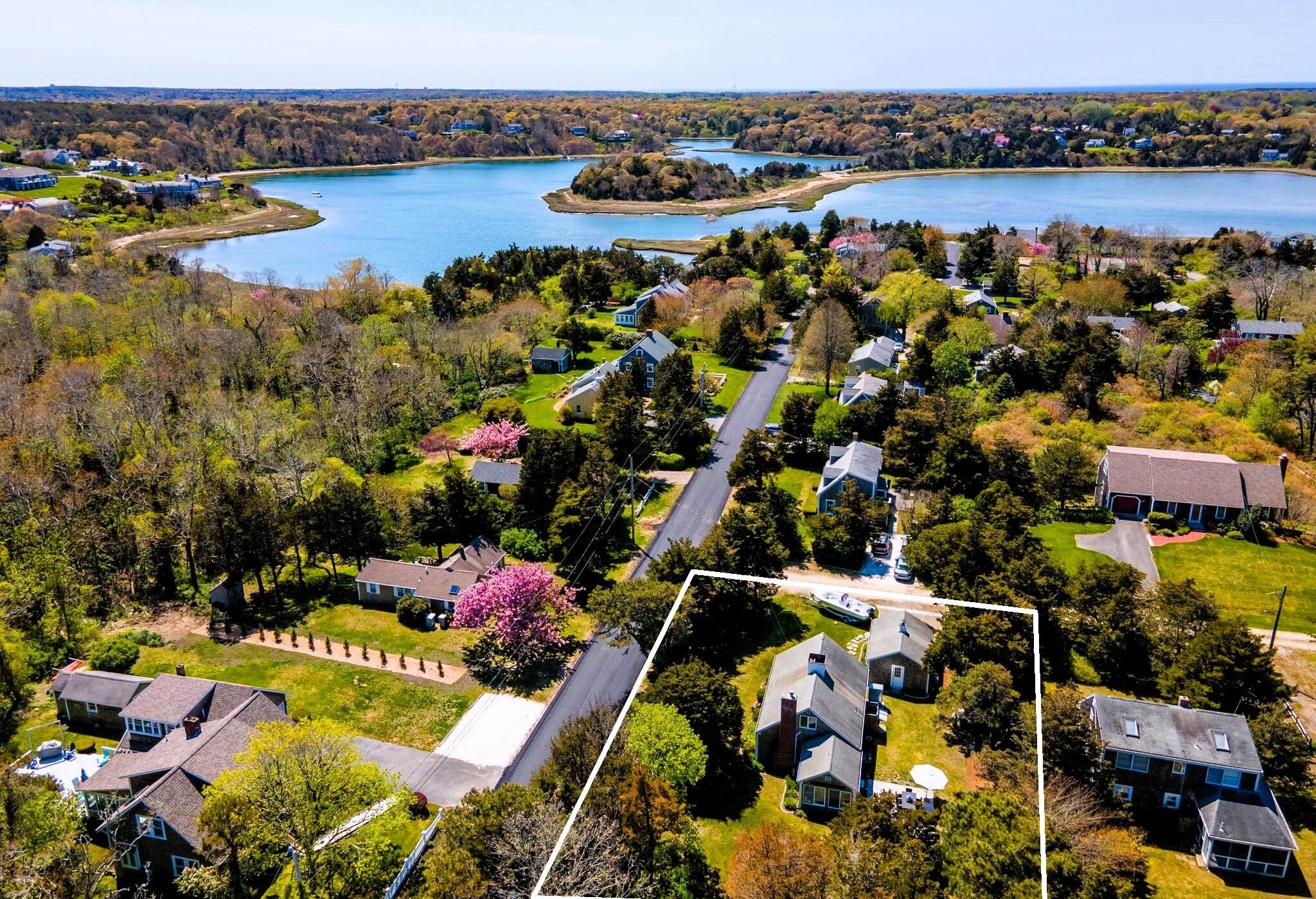9 Doane Road Orleans, MA 02653 - Photo 5 of 31 an aerial view of lake and residential houses with outdoor space