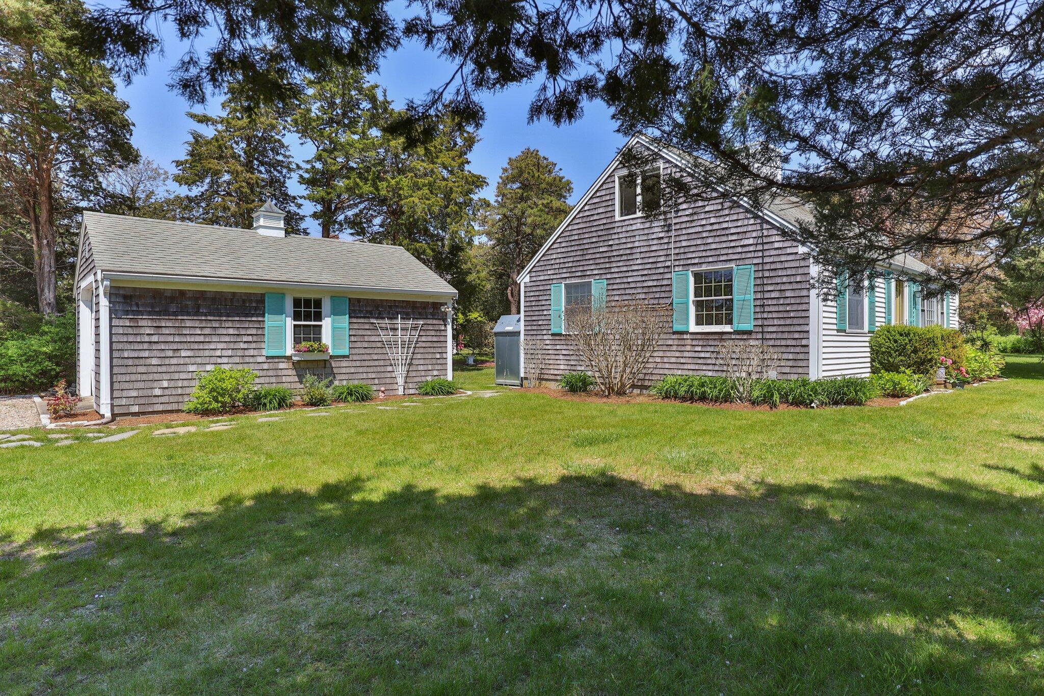 9 Doane Road Orleans, MA 02653 - Photo 7 of 31 a front view of house with yard and green space