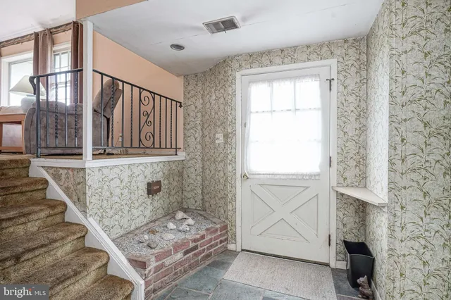 a view of an entryway with staircase