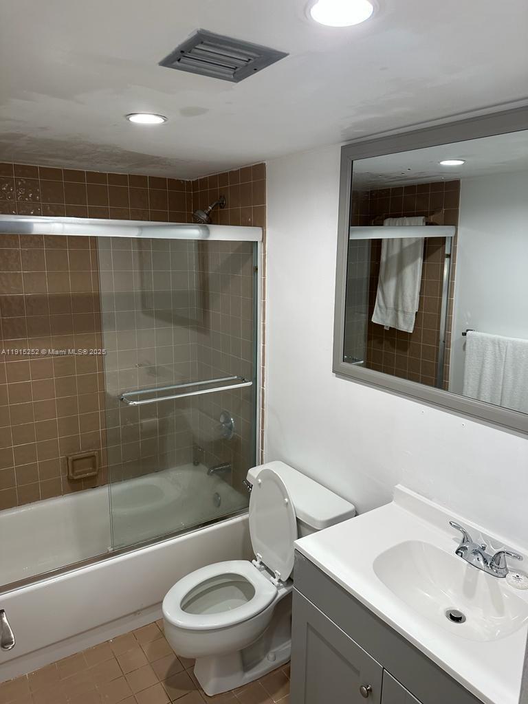 1621 Collins Avenue, Unit 505 Miami Beach, FL 33139 - Photo 12 of 25 a bathroom with a sink toilet and shower