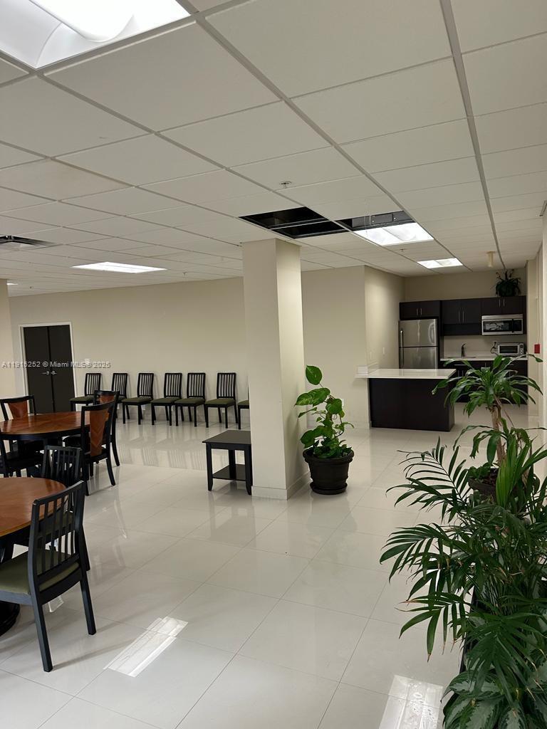 1621 Collins Avenue, Unit 505 Miami Beach, FL 33139 - Photo 18 of 25 a lobby with furniture and a potted plant